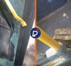 Pedra e dano causado por homem que vandalizou &ocirc;nibus no Recife.