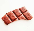 Nestl&eacute;, refor&ccedil;ando sua presen&ccedil;a no mercado de chocolates no Brasil.