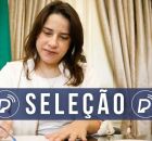 Raquel Lyra assinando documento.