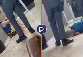 Policial militar &eacute; flagrado chutando mulher em surto. 