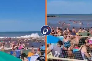 Banhistas em praia de Buenos Aires, onde ocorreu mini tsunami.
