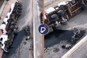 Ap&oacute;s o tombamento, parte da pista ficou coberta pelo &oacute;leo que vazou do caminh&atilde;o.