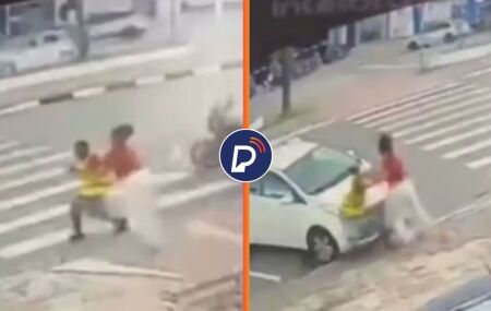 Homem atacando mulher na rua.