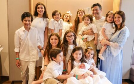 Casal Arasaki e seus 13 filhos. 