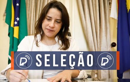 Raquel Lyra assinando documento.