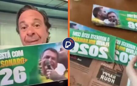 Gilson Machado distribui adesivos.