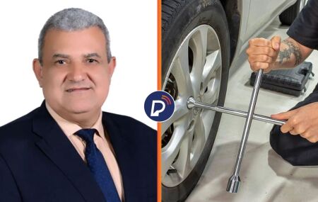 Vereador La&eacute;rcio Noberto J&uacute;nior ao ladode uma imagem ilustrativa de uma chave de roda.