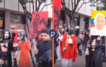 Vestidos de preto e mascarados, grupo LGBT+ realiza prociss&atilde;o com encena&ccedil;&atilde;o da crucifica&ccedil;&atilde;o de Jesus