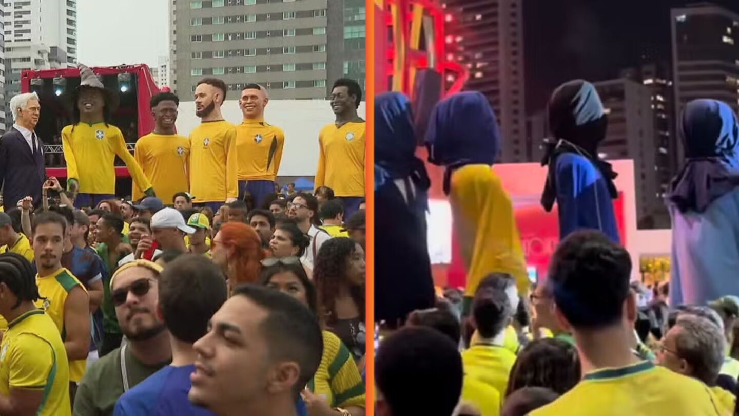 Após queda do Brasil, bonecos gigantes vão embora com cabeças cobertas no Recife.